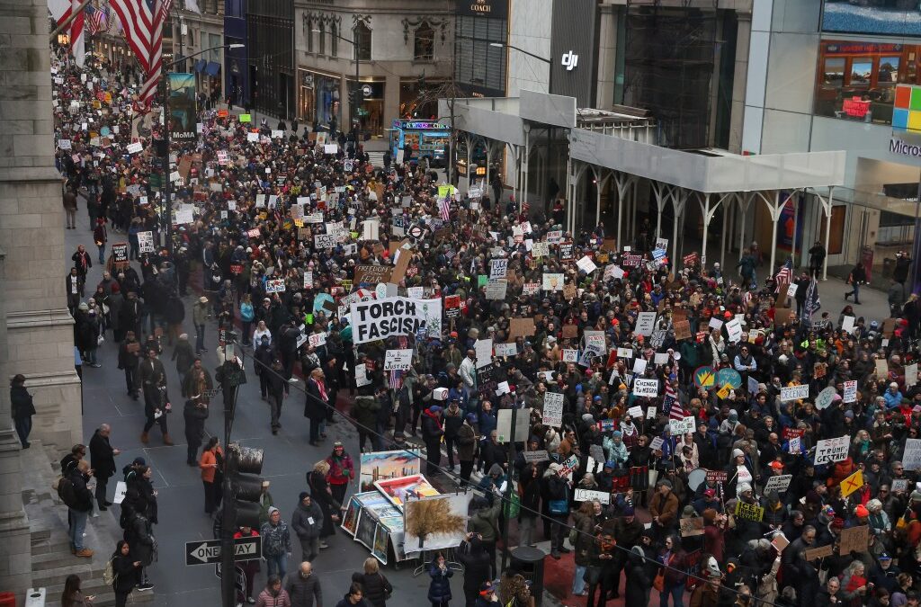 Thousands of anti-Trump protesters expected to walk off the job Tuesday