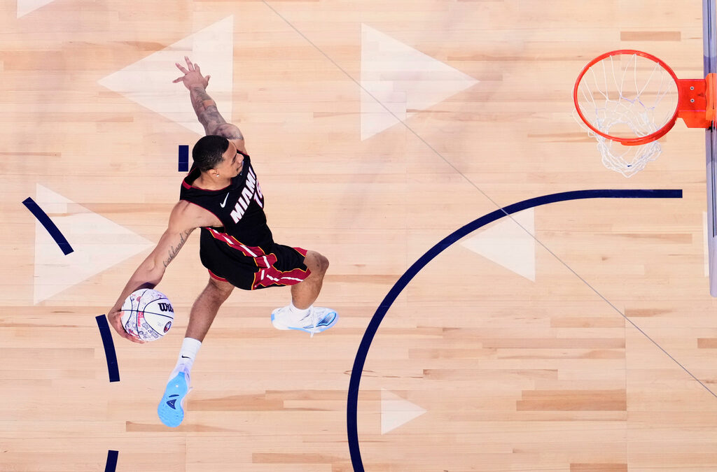 Heat’s Keshad Johnson soars to a slam dunk title, edging Carter Bryant who had a perfect score