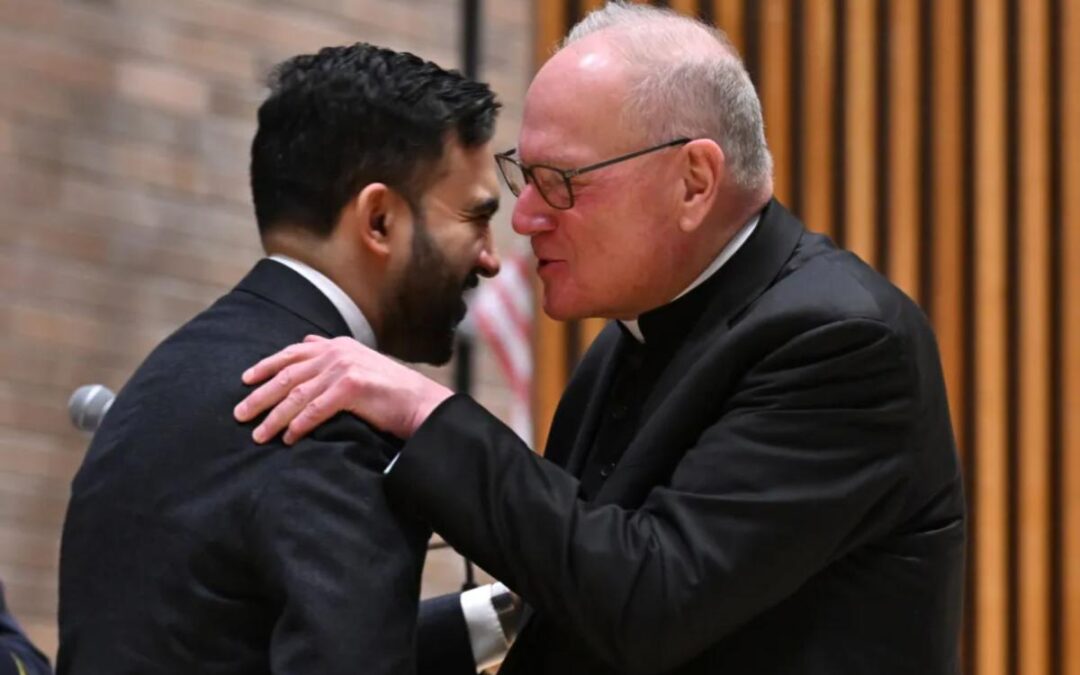 Cardinal Timothy Dolan chummily whispers into Mamdani’s ear at NYPD event — as ex-archbishop said he was ‘ticked off’ at mayoral snubs