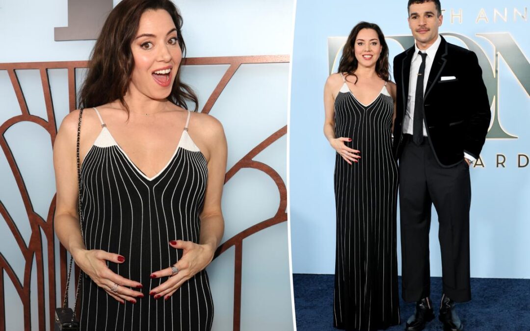 Aubrey Plaza cradles her baby bump while supporting partner Chris Abbott at Tony Awards 2026