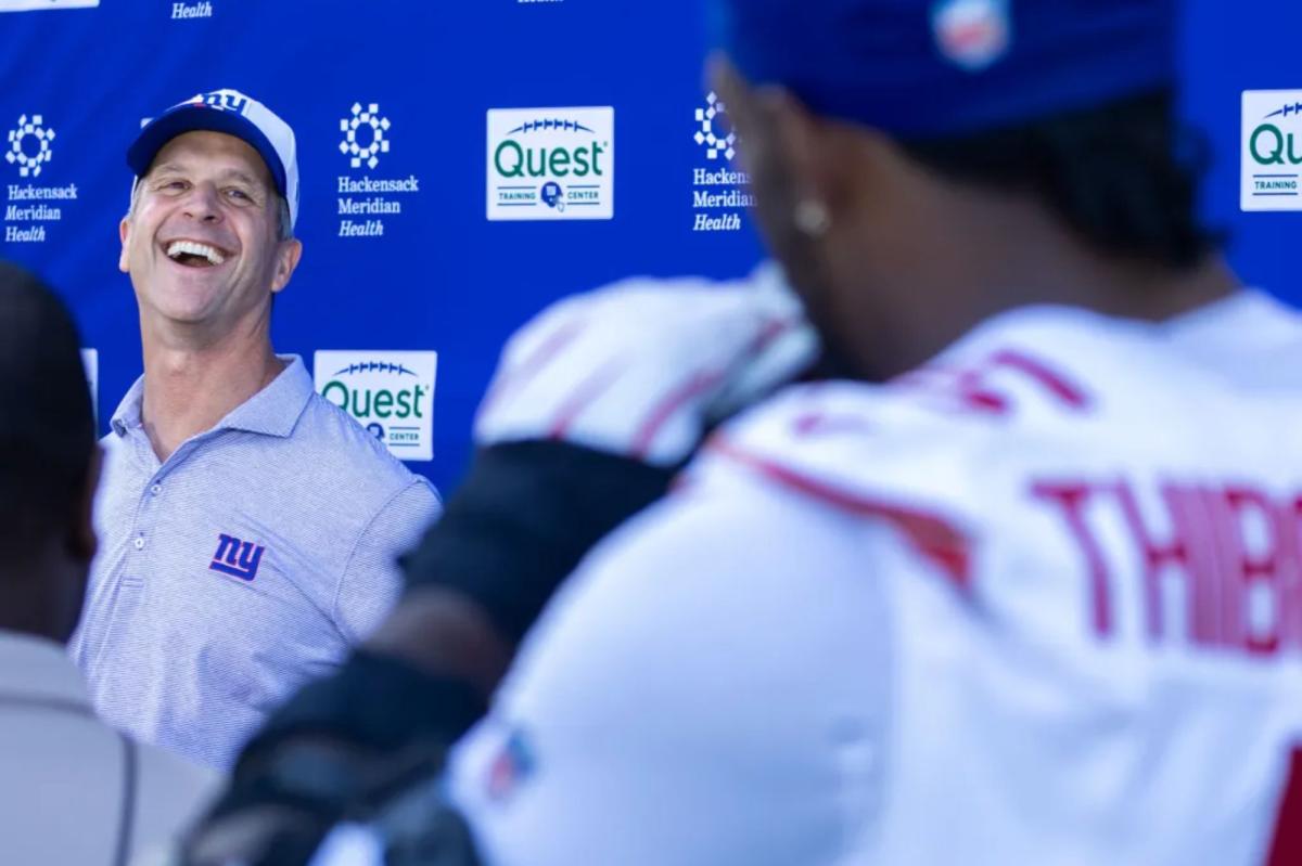 Kayvon Thibodeaux has some fun with John Harbaugh during Giants press conference