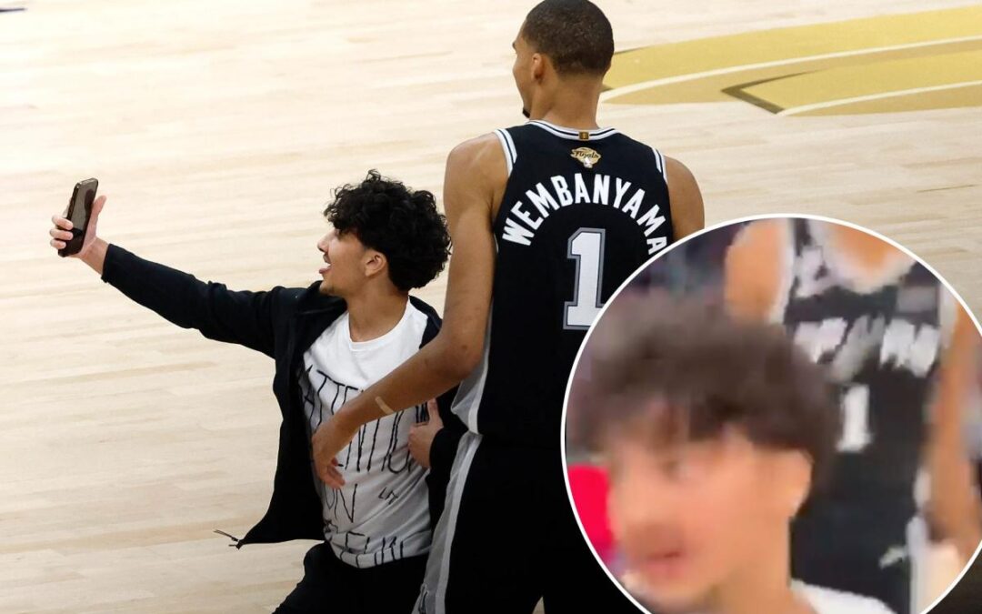 New angle shows fan storming court for selfie with smiling Victor Wembanyama in Knicks-Spurs NBA Finals